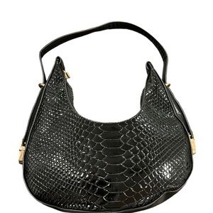 Saddle style adjustable straps black handbag only used in a photo shoot